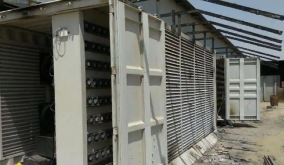 An aerial view of a modern mining farm showcasing advanced mining rigs in operation